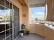 Cozy balcony with slider door access and neighborhood views at 8452 Boseck Dr # 225, Las Vegas, NV 89145
