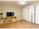 Bedroom featuring hardwood floors and sliding closet doors with unique decor at 8452 Boseck Dr # 225, Las Vegas, NV 89145