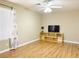Bedroom featuring hardwood floors, a ceiling fan, and a large bright window at 8452 Boseck Dr # 225, Las Vegas, NV 89145