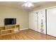 Bedroom featuring hardwood floors, ceiling fan, and sliding closet doors at 8452 Boseck Dr # 225, Las Vegas, NV 89145