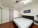 Bedroom featuring wood floors, a large window, and minimalist decor at 8452 Boseck Dr # 225, Las Vegas, NV 89145