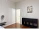 Cozy bedroom featuring a modern storage unit and warm hardwood flooring at 8452 Boseck Dr # 225, Las Vegas, NV 89145