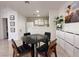 Dining area with modern furniture features a view of the kitchen at 8452 Boseck Dr # 225, Las Vegas, NV 89145