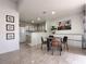 Open floor plan with a dining area featuring a kitchen and living room at 8452 Boseck Dr # 225, Las Vegas, NV 89145