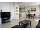 Modern living room with tile flooring, an open layout, and plenty of space to entertain at 8452 Boseck Dr # 225, Las Vegas, NV 89145