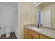 Bathroom features a single sink vanity, granite countertop, and tile flooring, plus shower and toilet at 9932 Keephills St, Las Vegas, NV 89183