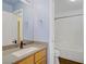 Bathroom features a single sink vanity, granite countertop, and tile flooring, plus shower and toilet at 9932 Keephills St, Las Vegas, NV 89183