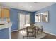 Dining area featuring a round table with seating and access to outdoor space at 9932 Keephills St, Las Vegas, NV 89183