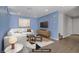 Bright living room with modern decor and a comfortable white sectional sofa at 9932 Keephills St, Las Vegas, NV 89183