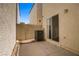 Enclosed patio area with a concrete slab and rock landscaping at 9932 Keephills St, Las Vegas, NV 89183