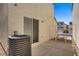 Concrete patio area with access to a small fenced yard and a side gate at 9932 Keephills St, Las Vegas, NV 89183