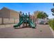 Community playground with a green slide at 9932 Keephills St, Las Vegas, NV 89183