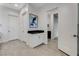 Neutral bathroom featuring a built-in vanity, modern art and access to various rooms at 10004 Terrastone Dr, Las Vegas, NV 89148