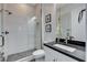 Modern bathroom features a glass shower with white tiled walls and a gray tiled floor at 10004 Terrastone Dr, Las Vegas, NV 89148