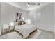 Bright bedroom with neutral decor, fan and plantation shutters at 10004 Terrastone Dr, Las Vegas, NV 89148