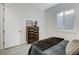 Bright bedroom features a window with shutters and door to access ensuite bathroom at 10004 Terrastone Dr, Las Vegas, NV 89148
