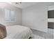 Bright bedroom features a window with shutters and ensuite bathroom entrance at 10004 Terrastone Dr, Las Vegas, NV 89148