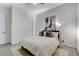 A wider view of a bedroom with a neutral decor and an adjacent closet at 10004 Terrastone Dr, Las Vegas, NV 89148