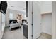 A bedroom features two beds, closet and wet bar with modern design and recessed lighting at 10004 Terrastone Dr, Las Vegas, NV 89148