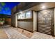 Contemporary home entrance with sleek gate, modern lighting, and stone accents at 10004 Terrastone Dr, Las Vegas, NV 89148
