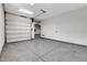 Garage with sealed floors and automatic door with a door leading to the house at 10004 Terrastone Dr, Las Vegas, NV 89148