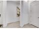 Hallway with neutral-colored walls and flooring with doors on both sides at 10004 Terrastone Dr, Las Vegas, NV 89148