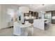 Modern kitchen with gray cabinetry, stainless steel appliances, and an adjacent breakfast nook at 10004 Terrastone Dr, Las Vegas, NV 89148