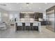 Modern kitchen featuring a large island with seating and stainless steel appliances at 10004 Terrastone Dr, Las Vegas, NV 89148