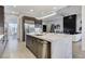 Spacious kitchen with gray cabinets, a quartz countertop island, and stainless steel appliances at 10004 Terrastone Dr, Las Vegas, NV 89148
