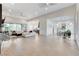 Expansive living room with tile flooring, plenty of light, and stylish, modern furniture at 10004 Terrastone Dr, Las Vegas, NV 89148