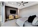 Spacious main bedroom with a large window, tiled floors, and comfortable seating area at 10004 Terrastone Dr, Las Vegas, NV 89148