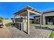 Outdoor kitchen and bar area featuring a built-in grill and bar seating at 10004 Terrastone Dr, Las Vegas, NV 89148