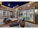 Inviting outdoor patio with string lights, ample seating, and indoor-outdoor flow at 10004 Terrastone Dr, Las Vegas, NV 89148