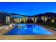 Inviting pool and spa with manicured landscaping and outdoor seating, ideal for relaxation at 10004 Terrastone Dr, Las Vegas, NV 89148