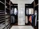 Large walk-in closet featuring custom organizers, shelving, and full-length mirror at 10004 Terrastone Dr, Las Vegas, NV 89148