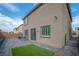 Paver stone backyard with patio furniture and well-maintained lawn at 10189 Magnolia Creek St, Las Vegas, NV 89141