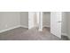 A bedroom with neutral walls, white trim, and a door to the closet at 10189 Magnolia Creek St, Las Vegas, NV 89141
