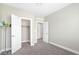 A small bedroom featuring neutral walls, white trim, closet, and door at 10189 Magnolia Creek St, Las Vegas, NV 89141