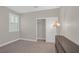 Cozy bedroom featuring a neutral color palette, closet, and natural light from the window at 10189 Magnolia Creek St, Las Vegas, NV 89141