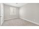 A basic bedroom with white trim and a window at 10189 Magnolia Creek St, Las Vegas, NV 89141