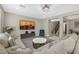 Comfortable living room with a sectional sofa, stylish decor, and plenty of space for entertaining at 10189 Magnolia Creek St, Las Vegas, NV 89141