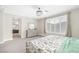 A large main bedroom with plantation shutters and modern ceiling light fixture at 10189 Magnolia Creek St, Las Vegas, NV 89141