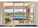 A view of the backyard pool from the living room, showcasing outdoor lounge and mountain scenery at 103 Reflection Cove Dr, Henderson, NV 89011