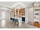 Stylish bar area with custom shelving, seating, and modern design, perfect for entertaining at 103 Reflection Cove Dr, Henderson, NV 89011