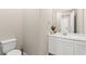 Bathroom featuring toilet and vanity with mirror at 103 Reflection Cove Dr, Henderson, NV 89011