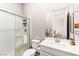 Modern bathroom featuring a glass-enclosed shower, stylish vanity, and ample lighting at 103 Reflection Cove Dr, Henderson, NV 89011