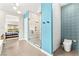 Bright bathroom featuring an enclosed shower, vanity and a toilet offering a combination of style and function at 103 Reflection Cove Dr, Henderson, NV 89011