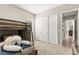 bedroom featuring bunk beds and large closet at 103 Reflection Cove Dr, Henderson, NV 89011
