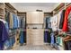 Spacious walk-in closet with custom shelving, drawers, and ample storage space at 103 Reflection Cove Dr, Henderson, NV 89011