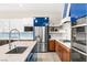 A modern kitchen is showcased with stainless steel appliances, and ample cabinet space at 103 Reflection Cove Dr, Henderson, NV 89011